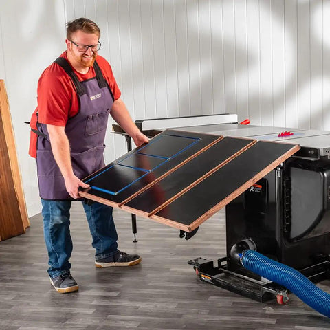 Person adjusting Folding Table Saw Outfeed Kit With Adjustable Height Legs And Foldable Steel Frame For Easy Storage.