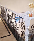 Top Shelf Bronze Wrought Iron Balusters 25 Pack 95Cm Height Anti Rust Railing Spindles For Deck Stair Posts And Porch Banister Columns No Sweat Quick Diy Refresh on a decorative white railing.