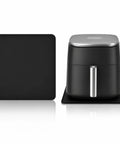 Slide Mat For 9 In 1 TurboBlaze Air Fryer With Anti Slip Base And Hanging Strap, Easy Clean Countertop Protector. Image of mat with air fryer.