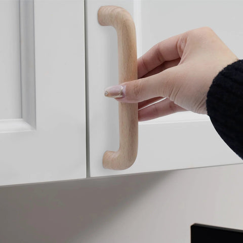 Installing a Beech Wood Drawer Pulls Unfinished Cabinet Handles For Kitchen Cupboards Dresser Wardrobes And Closets on a white cabinet