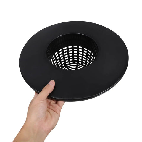 Hand holding a black Durable Hydroponic Mesh Net Pot Bucket With High Drainage for Healthy Roots and Easy Garden Setup.