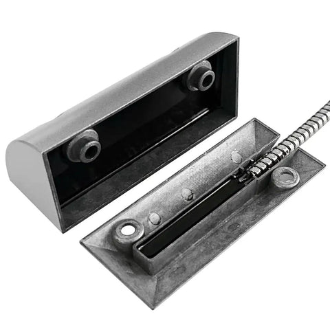 Rugged Wired Garage Door Magnetic Switch For Roller Shutter NC With 15 Inch Armored Cable Heavy Duty Sensor Over Two Inch Operation Distance Beefy Metal Housing For Reliable Door Monitoring For Home Security Systems, showing rugged metal housing and cable detail.