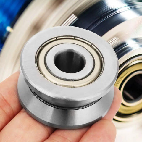 Top Shelf Sealed Metal V Groove Track Roller Guides With Precision Ball Bearings Designed To Handle Heavy Machinery And Equipment Without Skipping A Beat At 12X41X20MM Dimensions in hand, showcasing the roller's sleek design.