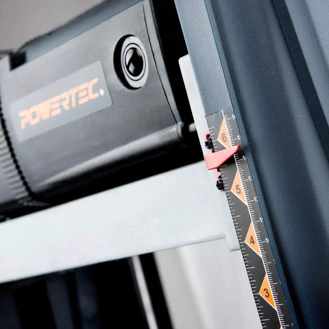 Close-up of the adjustment scale and motor on the Smooth As Glass 15 Amp Benchtop Thickness Planer for precise measurements.