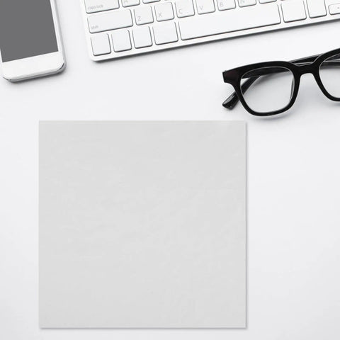 Top Shelf Reusable White Microfiber Cleaning Cloth For Eyeglasses And Camera Lenses Ultrafine Cleanroom Grade Polish on a desk with glasses and smartphone.