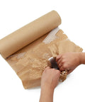 Top Tier Honeycomb Packing Paper Bubble Wrap Alternative For Moving Supplies Stretchy Kraft Cushion Roll being unrolled and used.