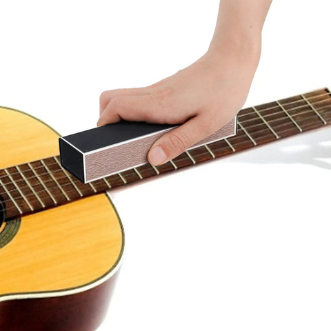 Hand using fret leveling beam on guitar fretboard, part of Guitar Luthier Tool Kit Pro Grade With Fret Crowning File Fret Rubber Hammer.