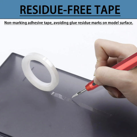 Close-up of Premium Tungsten Steel Model Scriber Blades Pair cutting residue-free tape on black model surface.