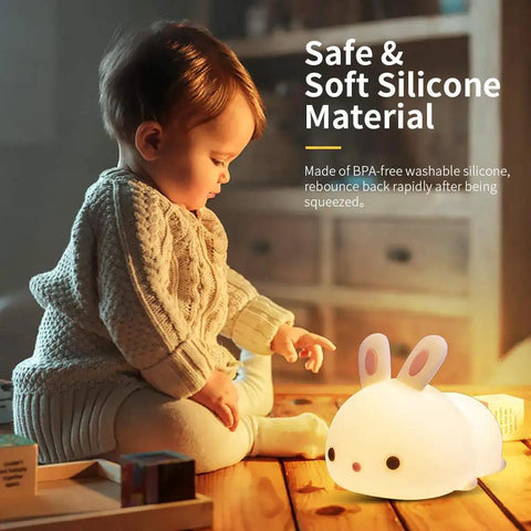 Child playing with Lit Cute Bunny Night Light For Kids With 16 Colors Tap Control Dimmable Lamp, safe silicone, on wooden floor