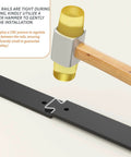 Close-up of installation process for 60 Inch Bifold Barn Door Hardware Kit, using rubber hammer on thickened carbon steel track.