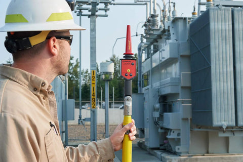 Field tech using High Voltage Detector Kit For Field Techs 30 V To 122 kV AC Intrinsically Safe Pro Grade MSHA Certified Amprobe TIC 300 PRO