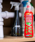 StaySafe All In One Portable Fire Extinguisher That Handles Ten Types Of Fires From Electrical And Kitchen Oils To Lithium Battery Blazes With A Non Toxic Eco Friendly Formula For Home Car And On The Go on a shelf with cleaning products.