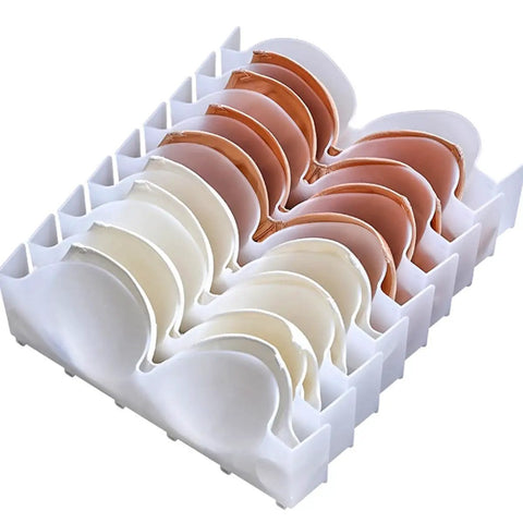 Six Piece Clear Plastic Bra Storage Box With Dividers For Wardrobe Closet Drawer Organization To Keep Lingerie Lineup Hella Neat And Shielded From Deformation A Straight Up Must Have Staple with white dividers and various bra colors neatly organized.