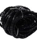 Heavy Duty Wire Protector Sleeves To Crush Fraying And Tangles Black Braided Cable Management Tube coiled for easy storage.
