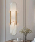 Backplate Sconce With Alabaster Shade Modern Bathroom Wall Light installed on wall, sleek design, thick backplate, three finishes, 20 In H