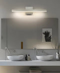 Modern Slick LED Vanity Light Fixture for Bathroom Mirror, Brushed Nickel, 23.62 Inch, 18W, mounted above double sinks.