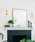 ELYCCUPA 10” Marble Wall Sconces Set of Two Matte Black Classic Stone Alabaster Wall Lights for Bedside Vanity Hallway, UL Listed, displayed beside a mirror.