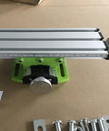 Portable Milling Machine Work Table Vise with Adjustable XY Compound Slide, shown in close-up with aluminum frame and green base.