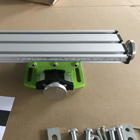 Portable Milling Machine Work Table Vise with Adjustable XY Compound Slide, shown in close-up with aluminum frame and green base.