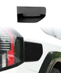 Fresh Glossy Black EV Charging Port Cover Trim Compatible With Kia EV9 2024 2025 2026 on white vehicle rear view.