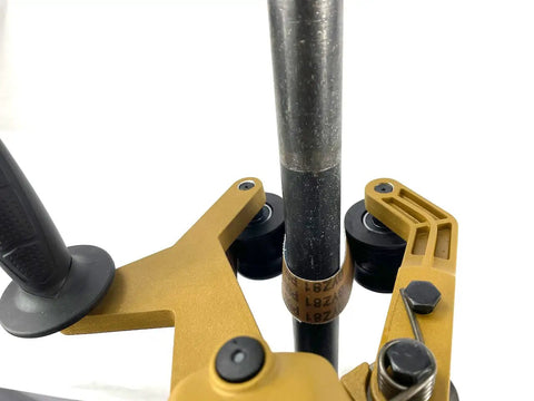 Badass Bbs-40a Pipe Polisher And Grinder Including 100 Sanding Belts Kit Variable Speed Belt Sander close-up on metal pipe.