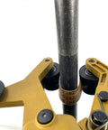 Close-up of Straight Up Workhorse 40A Pipe Sander And Polisher, showcasing metal tubing and sanding rollers in use.