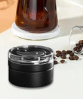 Smooth Operator 58mm Coffee Distributor And Leveler For Tight Espresso Pucks on a kitchen counter with coffee beans.