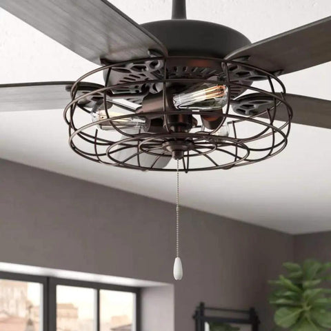 Ceiling fan with metal cage and pull chain in a modern room