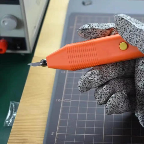 Close-up of Handheld 35 Khz Ultrasonic Cutting Knife for 3D Resin and PLA Models in a gloved hand, showing the sharp blade.