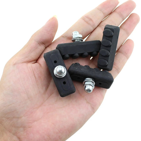 Eight Pack Bicycle Black Rubber Brake Pads 45mm For Road Bike C Type Braking System Durable Quiet Wet Weather Performance With Rim Protection Against Sand Dirt And Stones held in hand