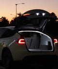 Tesla Model Y 2025 trunk open with Dual Color Trunk LED Light Strip, waterproof silicone lighting in 3000K warm white at night