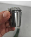 Hand holding Top Tier Spring Collet For CNC Milling And Engraving Machine With ER11 ER20 ER32 Precision Holders.