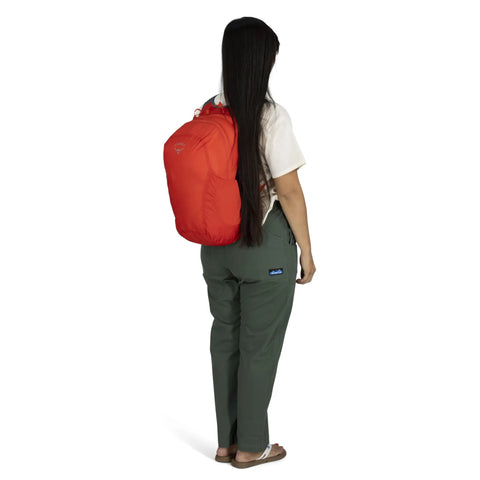 Rear view of person wearing red Ultralight Collapsible Travel Day Pack For On The Go Trips Packable 18 L Expandable Luggage Bag