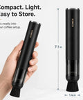 Person holding Rechargeable Mini Coffee Grinder Vacuum Cleaner With 4 Attachments, shown with size dimensions.