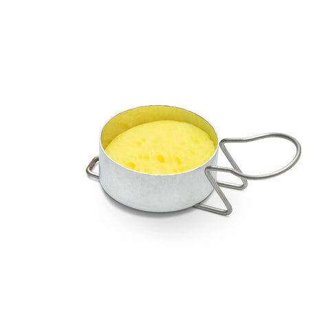 Metal egg cooking ring with handle on white background.