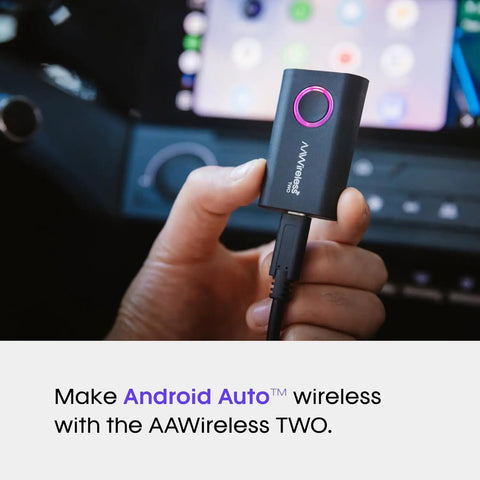 Hand holding Wireless Android Auto Adapter that converts factory wired to wireless with Bluetooth and WiFi auto connect