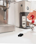 Steam Wand Rubber Guard Sleeve Heat Insulation Accessory For Espresso Machines on counter next to espresso setup.