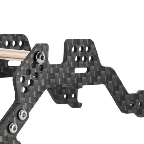 Close-up of Carbon Fiber LCG Chassis Kit for TRX4M Bronco One Eighteen RC Crawler showing low gravity frame and shock mounts