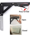 Heavy Duty Folding Shelf Bracket Set Black Metal Triangular Hinge Supports For Wall Mounted Shelves And Benches 8 Inch 2 Pack Load Capacity Up To 99lb Durable Steel Construction shown in open and closed positions with press-to-fold feature