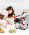 Versatile Heavy Duty Electric Noodle Machine Make Fresh Spaghetti Lasagna And Linguine No Fuss Adjustable Dough Roller in use with mother and child.