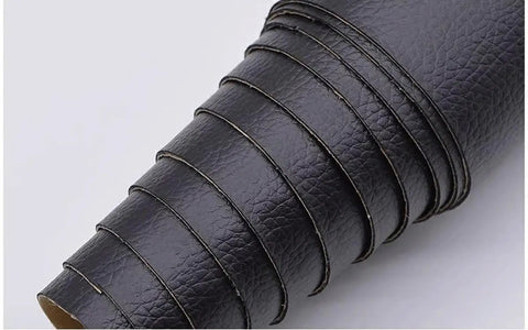 Rolled sheets of black self adhesive leather repair tape 54 by 20 inch for couches sofas chairs car seats furniture and handbags.