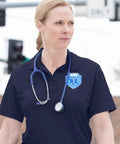 Women's Short Sleeve Cotton Polo Shirt Built For The Daily Grind With Sick Comfort Straight Up Ntoa Approved First Responder Gear Kickass Uniform Fit In Midnight Navy Xxl worn by EMT with stethoscope.