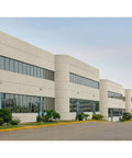 Commercial building with WPMLED25B Beefy 12,000 Lumens Outdoor LED Wall Pack Light, bronze exterior, illuminating the walkway.