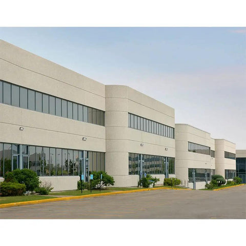 Commercial building with WPMLED25B Beefy 12,000 Lumens Outdoor LED Wall Pack Light, bronze exterior, illuminating the walkway.