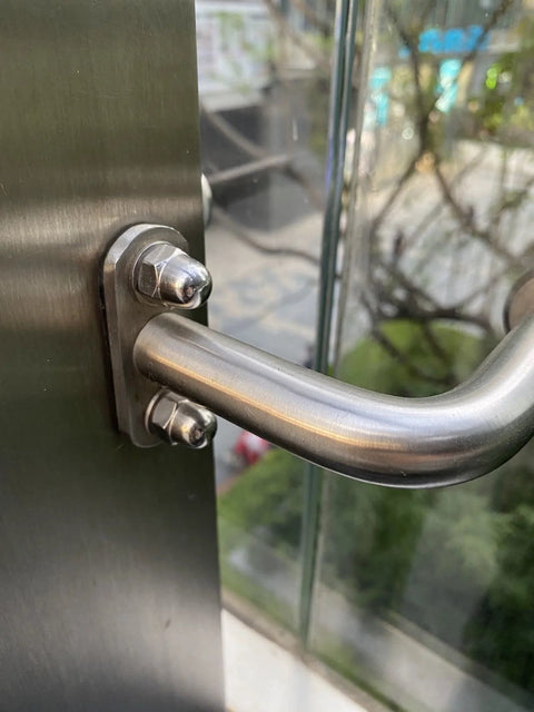 Installed M12 stainless steel flat fender washer on door handle mount; 12mm ID, 24mm OD, 2.0mm thick.