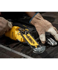 Black and yellow Cordless Pruning Chainsaw 20V 8 Inch For Quick Yard Trims, Lightweight One Hand Comfort Grip, DCCS623B Model in use