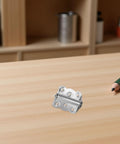 Heavy Duty Stainless Steel Spring Door Hinges 10 Pack for Outdoor Wood Doors and Cabinets Built Tough All Weather Durability Adjustable Spring Tension Easy Install Weatherproof Silver Hinges, close-up on wood