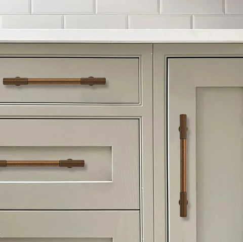 Antique Brass Heavy Duty Cabinet Pulls Ten Pack With 3 Inch Hole Center showing on kitchen drawers and doors, vintage hardware.