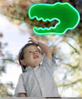 Boy gazing at Totally Lit Dinosaur Head Neon Sign For Kids Bedroom Decor USB Or Battery Powered Neon Light Wall Art