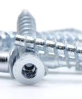 Close-up of M7 X 50mm Confirmat Screws for wood furniture assembly, showing flat head hex drive and threading.